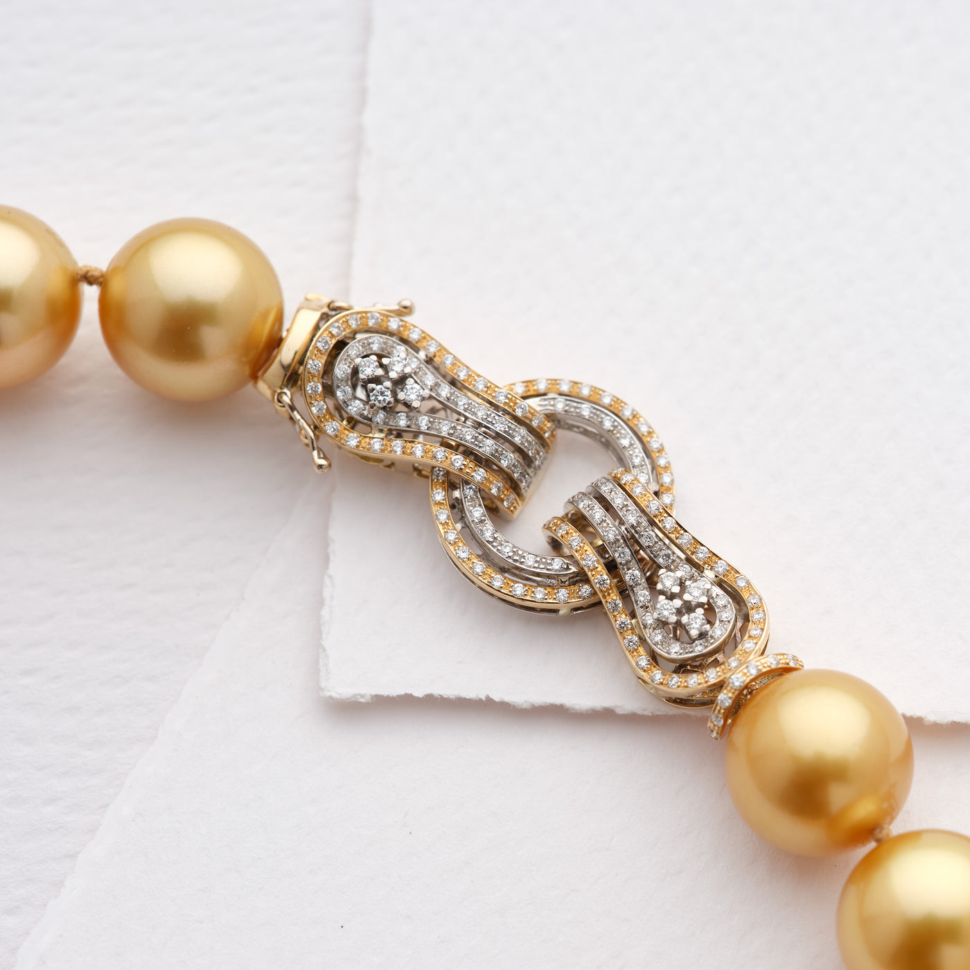 Diamond Clasp in 18K White & Yellow Gold and Golden South Sea pearls. 