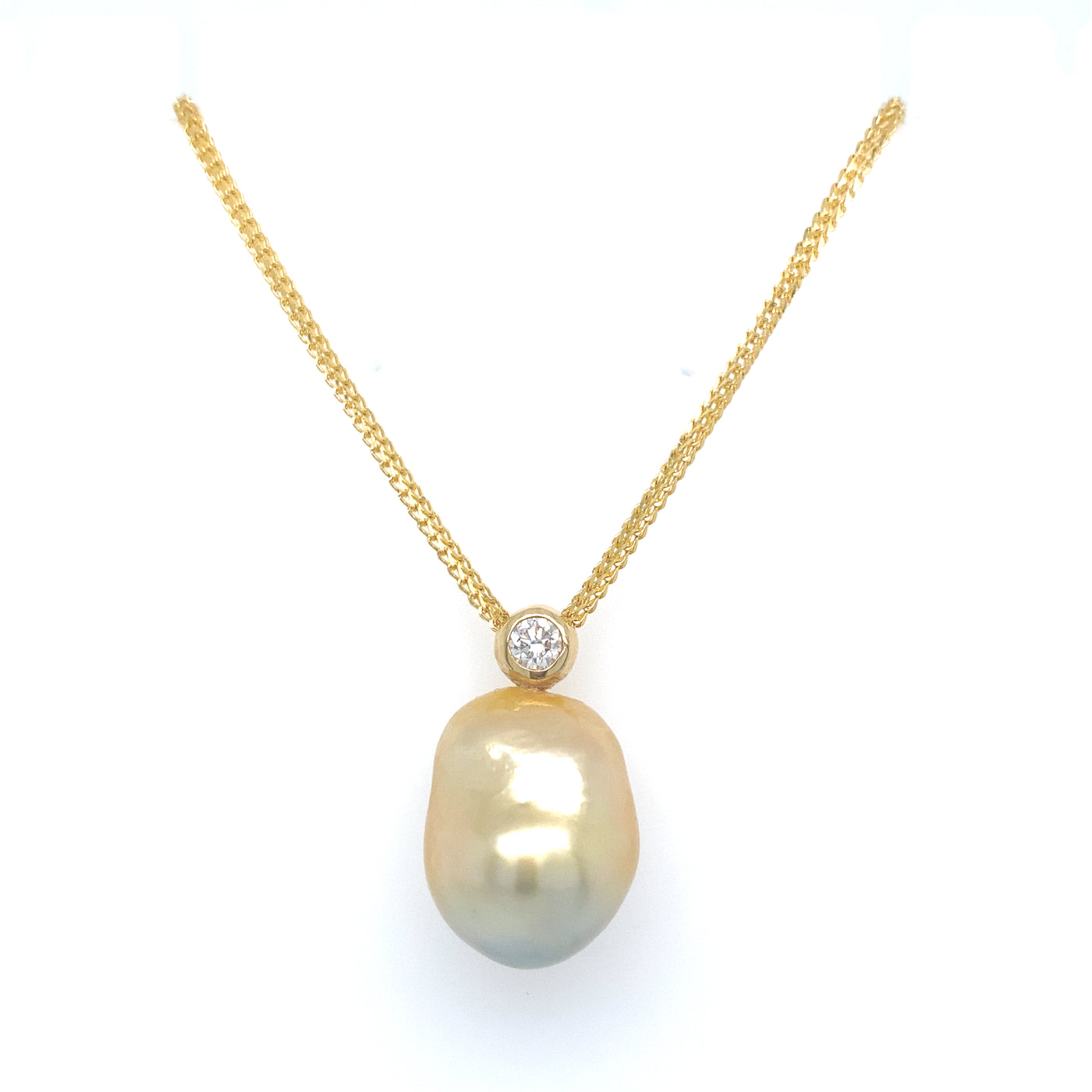 Our Diamond Bezel Baroque Pendant features a 15-16.5mm Golden South Sea Baroque Pearl, .5ct diamond, and 18KY gold chain.