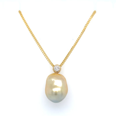 Our Diamond Bezel Baroque Pendant features a 15-16.5mm Golden South Sea Baroque Pearl, .5ct diamond, and 18KY gold chain.