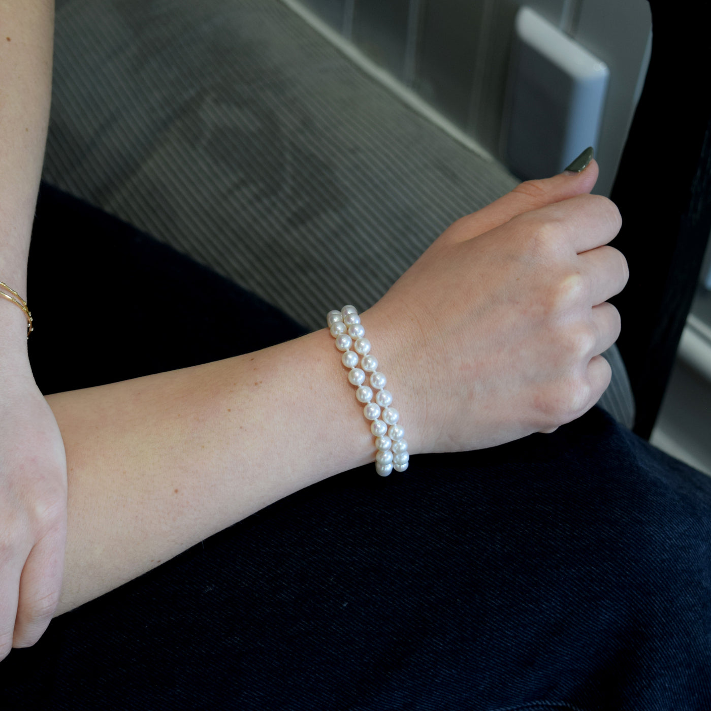 Dual Strand Freshwater Bracelet. Featuring lustrous white pearls and a gold clasp
