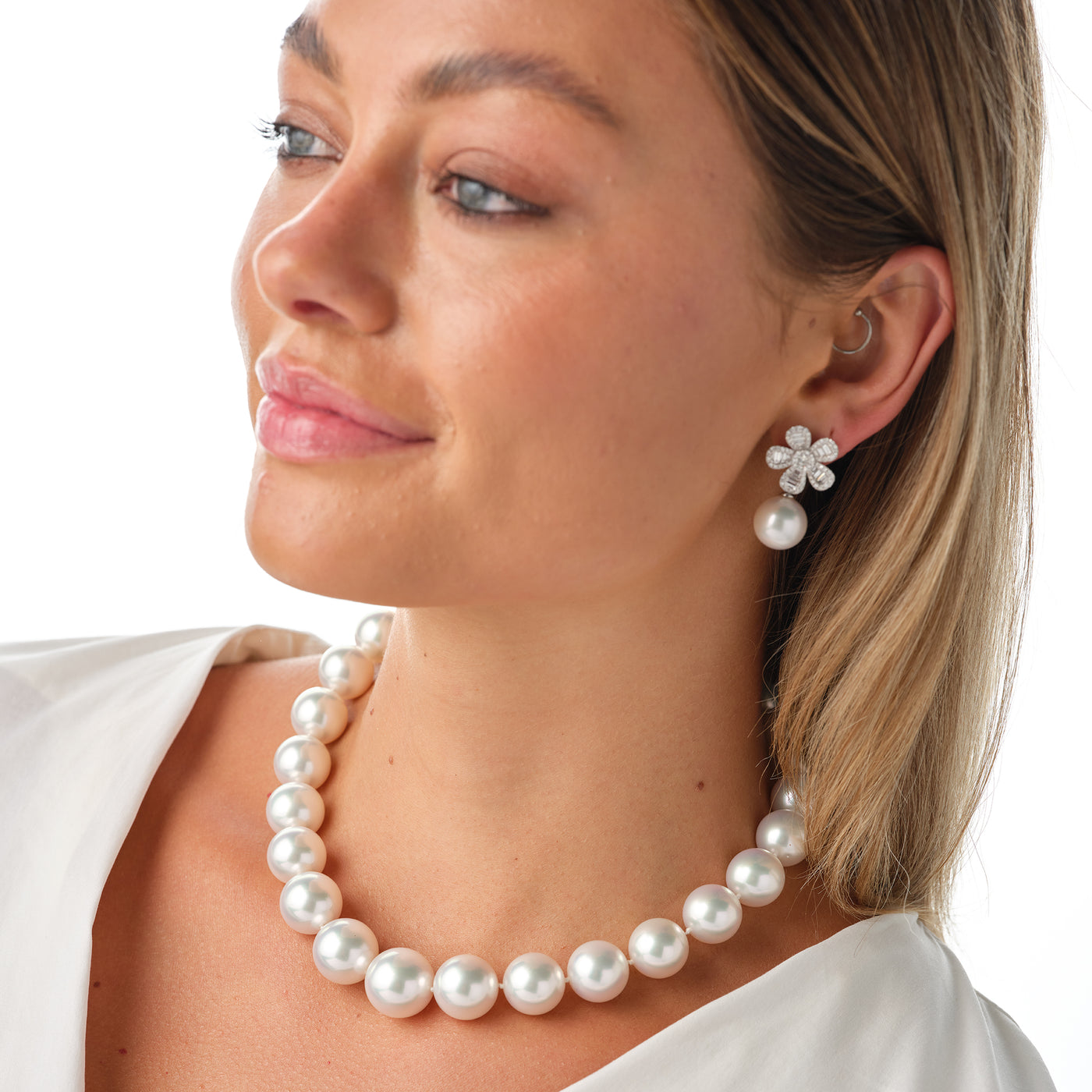 One of a Kind large natural white south peal strand with diamond clasp. From the vault, one of a kind, custom design, be spoke necklace. Matching earrings in flower design with diamonds and white south sea pearls. 