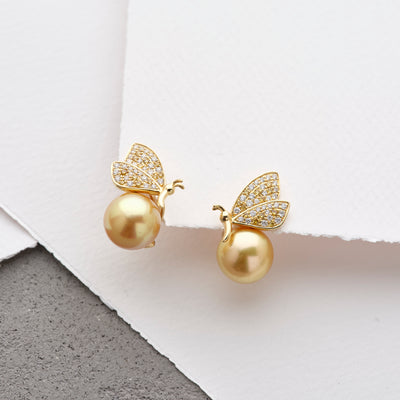 Luminous Golden South Sea Pearl earrings from our new Pearls by Shari, Butterly Collection, featuring your choice of 18K White or Yellow gold and shimmering white and yellow diamonds.