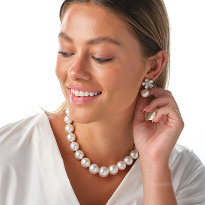 One of a Kind large natural white south peal strand with diamond clasp. From the vault, one of a kind, custom design, be spoke necklace. Matching earrings in flower design with diamonds and white south sea pearls. 