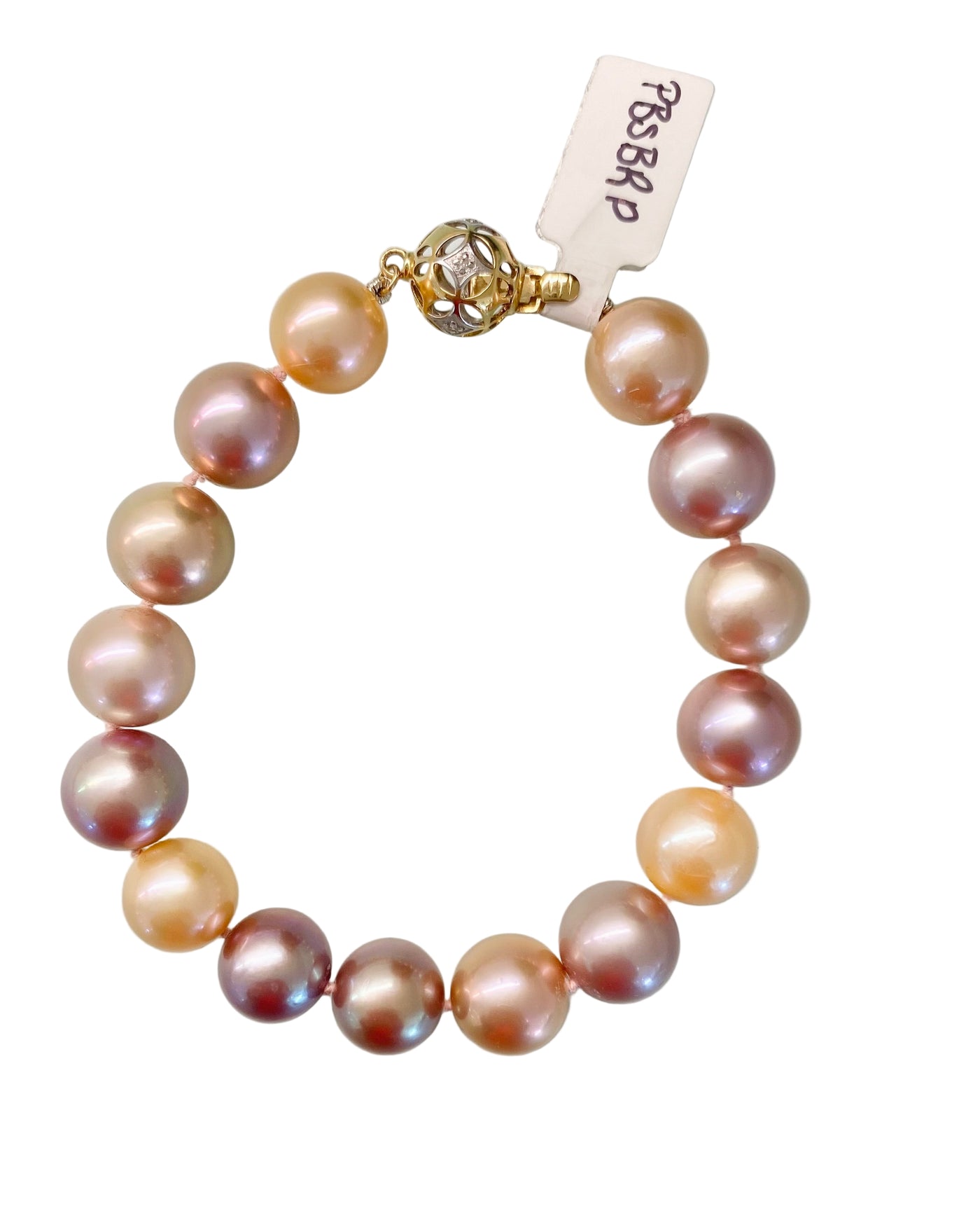 This bracelet features 10-11mm natural pink cultured pearls, elegantly secured with an 18K white and yellow gold filigree clasp.