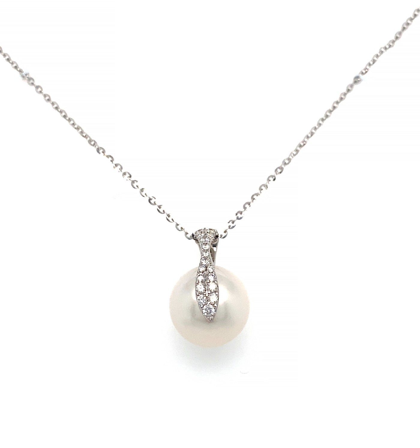 This elegant pendant showcases a 12mm White South Sea Pearl complemented by diamond accents, all set on an 18KW gold chain and mounting.